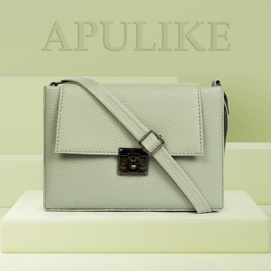 Elegant light green crossbody bag crafted from durable textured leather, featuring an adjustable strap